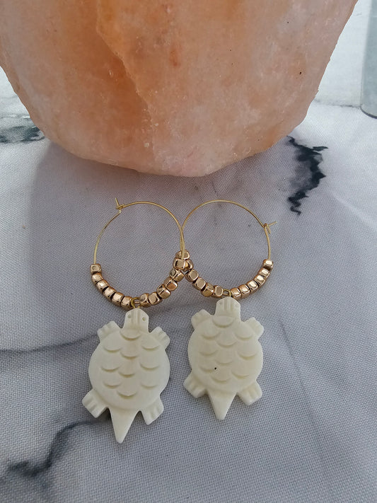 Gold beaded hoops with turtles