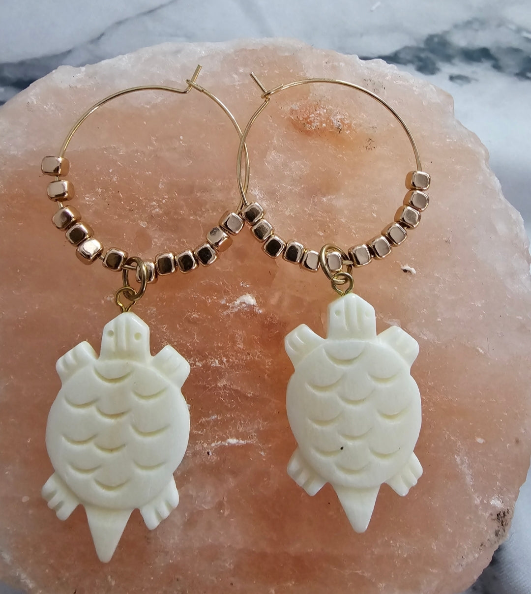 Gold beaded hoops with turtles